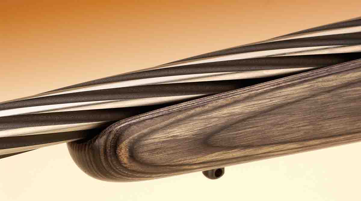 The forend is rounded off with no tips or spacers, and the barrel is spiral-fluted.